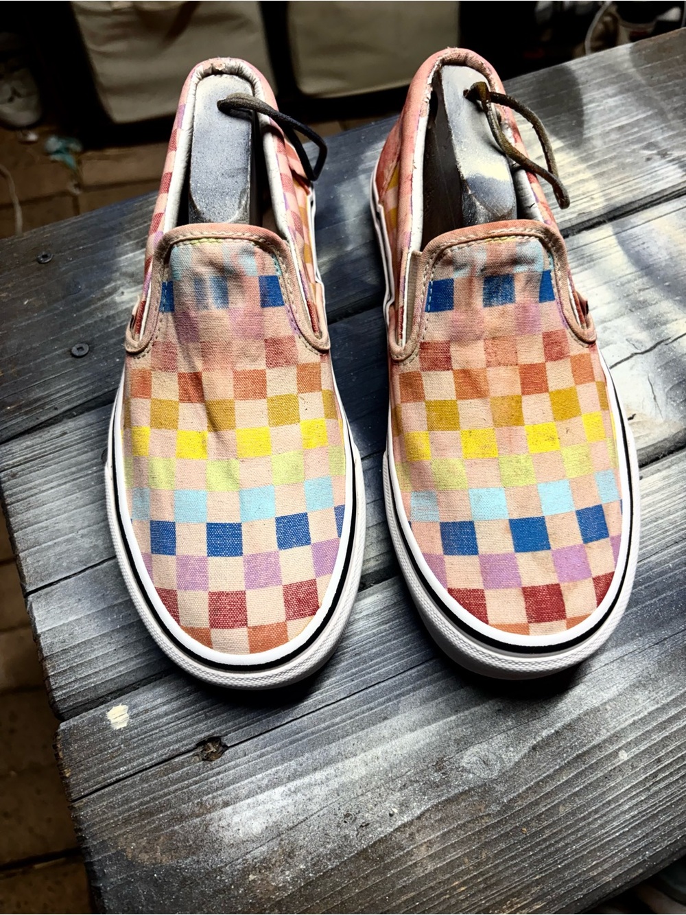 Vans slip on sneakers with multicolored checkered pattern in women’s 10